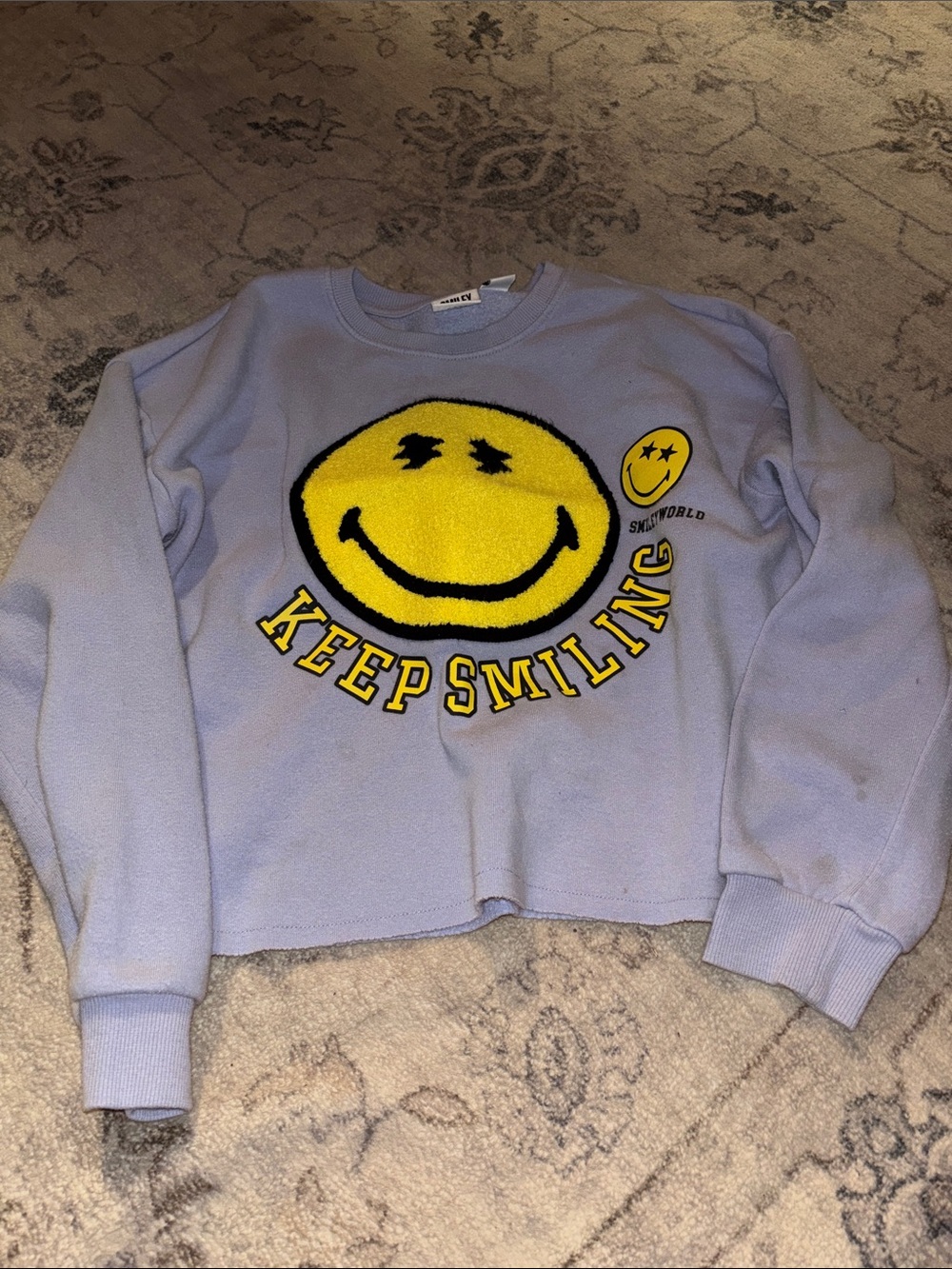 Keep Smilin' Lavender Crewneck Sweatshirt with Yellow Smile Graphic